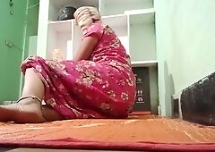Secret home encounter between a woman in a pink dress and her dark-skinned partner