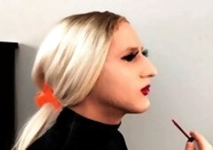 Crossdresser Bailey Wilde and a woman applying lipliner and lipstick together