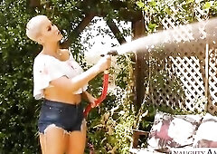 Short haired, golden-haired woman with large breasts, Ryan Keely is screwing a younger man, on the sofa