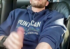 Beefy guy jerks off in the car