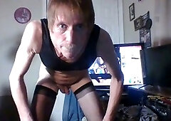 Crossdresser plays with boner and dildo