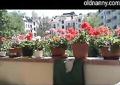 Slutty old older likes to masturbate outdoor on her balcony where everyone can see her