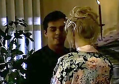Nina Hartley and her lover screwing passionately.