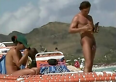 Naked babes caught on the camera relaxing on the beach