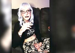 Luna smokes relaxing on the bed.