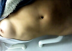 Sensual teen gets naked and masturbates in a public toilet