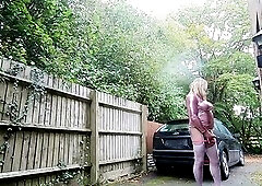 kelly cd having a lewd stroke on the driveway as cars are driving past on a busy main road