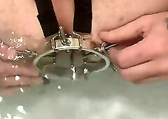 Enema, anal shower. Close-up view through anal mirror. Anal with water. Filling anal with water