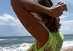 Chinese wifey Appleliu76 gives a beach handjob in a fishnet dress