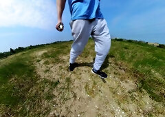 Freeballing walk in nature with a good-sized sweatpants erection