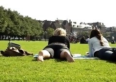 Street voyeur films a blonde and a brunette in the park