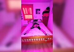 box style armbinder secured on.. ballet boots locked on with ankle cuffs secured to daybed posts.. cum stained pants secured in throat with panel gag.