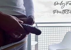 Ebony beauty gives a handjob to a big black cock and enjoys a jizz-filled orgasm