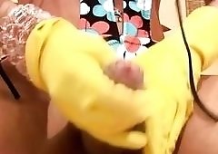 Delicious babe uses dish washing gloves to wank her dick