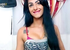 Dark-haired Tgirl shows off her huge sausage