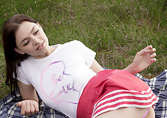 Gorgeous young redhead plays with herself at the forest's edge