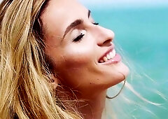 Smoking hot nude teen posing in the sand