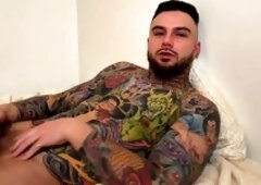 Sensual gay vibes with a hot tattooed guy enjoying a slow handjob