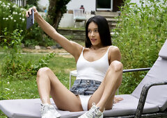 Slender brunette teen plays with her succulent pussy in addictive outdoor solo