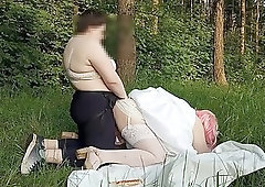 Surrender to the ass in a forest clearing