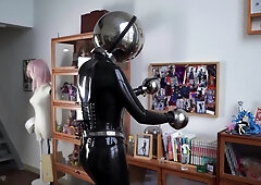 Girl In Latex And Metal And Chastity Belt With Vibrator