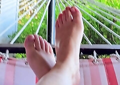 Brunette with foot fetish rubs big dick with her feet in POV