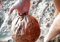 Good lady at lonely nudist beach. Red swimsuit. Red bikini. Coconut