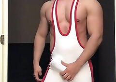 230 Stroking himself in doorway in white and red singlet in house