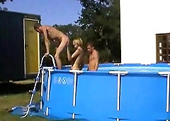 Teen gays in a pool and by it