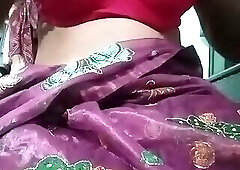 Indian Gay Crossdresser Bottom Gaurisissy pressing and playing with her big boobs in purple saree