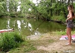 Two cute and charming brunette lesbians eat cunts on the pink rag outdoors