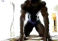 Ebony Body Builder Playing With His Muscles