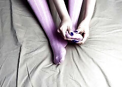 Pink socks in hands of headmistress with blue nails in solo clip