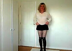 Black fishnets, miniskirt and see-through blouse