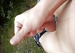 Naughty guy masturbates his dong in public