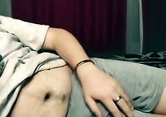 Naughty young guy pleasures himself on the bed in hopes of getting caught.