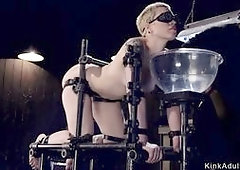 Blonde slave in gas mask gets whipped