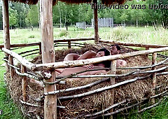 Slender brunette with long legs shares an intimate moment in the hayloft as her partner slowly fills her completely beneath the dusty rafters