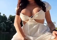 TS Bimba cums in the beach