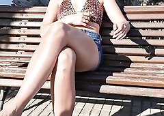 On a bench in a park in the Canary Islands I flash my boobs