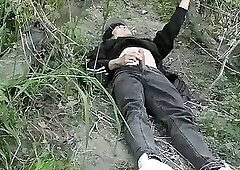 Cute guy is masturbating out in the open with his dick hanging out of his pants