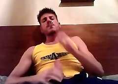 Enjoying a cigarette while I beat my big cock