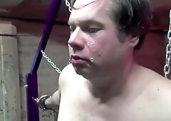 Sexy Asian mistress in latex slaps a slave and spits in his mouth.