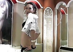 Brunette Asian tranny with small tits jerks it off solo