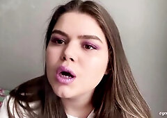 I'm wearing purple makeup and lipstick. I'm smokin' two cigarettes and play with the smoke. I do some smoke rings, multiple drags and s