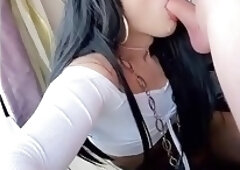 Striking shemale with sexy glasses films herself deepthroating big cock