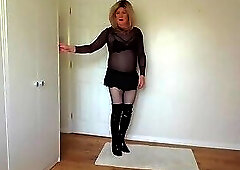 Blonde in black bra, miniskirt and latex boots