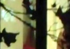 Hot MILF's round ass caught through window