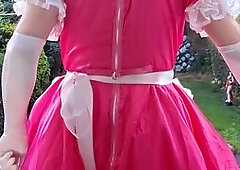 EXPOSING MYSELF DRESSED IN A PINK SISSY MAIDS DRESS IN MY BACK GARDEN.