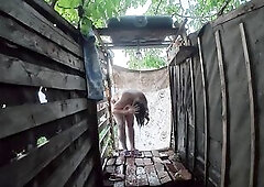 Tanya from Tanyasilik in breathtaking 4K quality with distant peeping angle as if watching from afar. That babe washes in the outdoor summer shower in